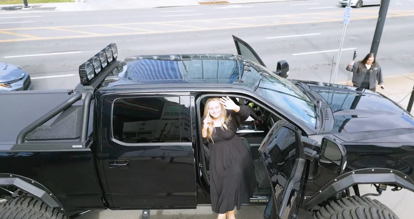 Breanna Nix stepping out of a black truck in downtown Nashville.