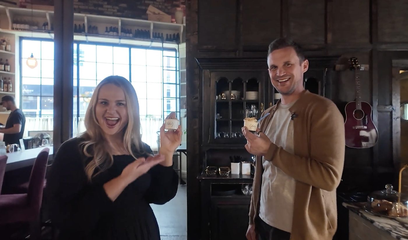 Breanna Nix and a collaborator sharing a candid moment inside a Nashville cafe.