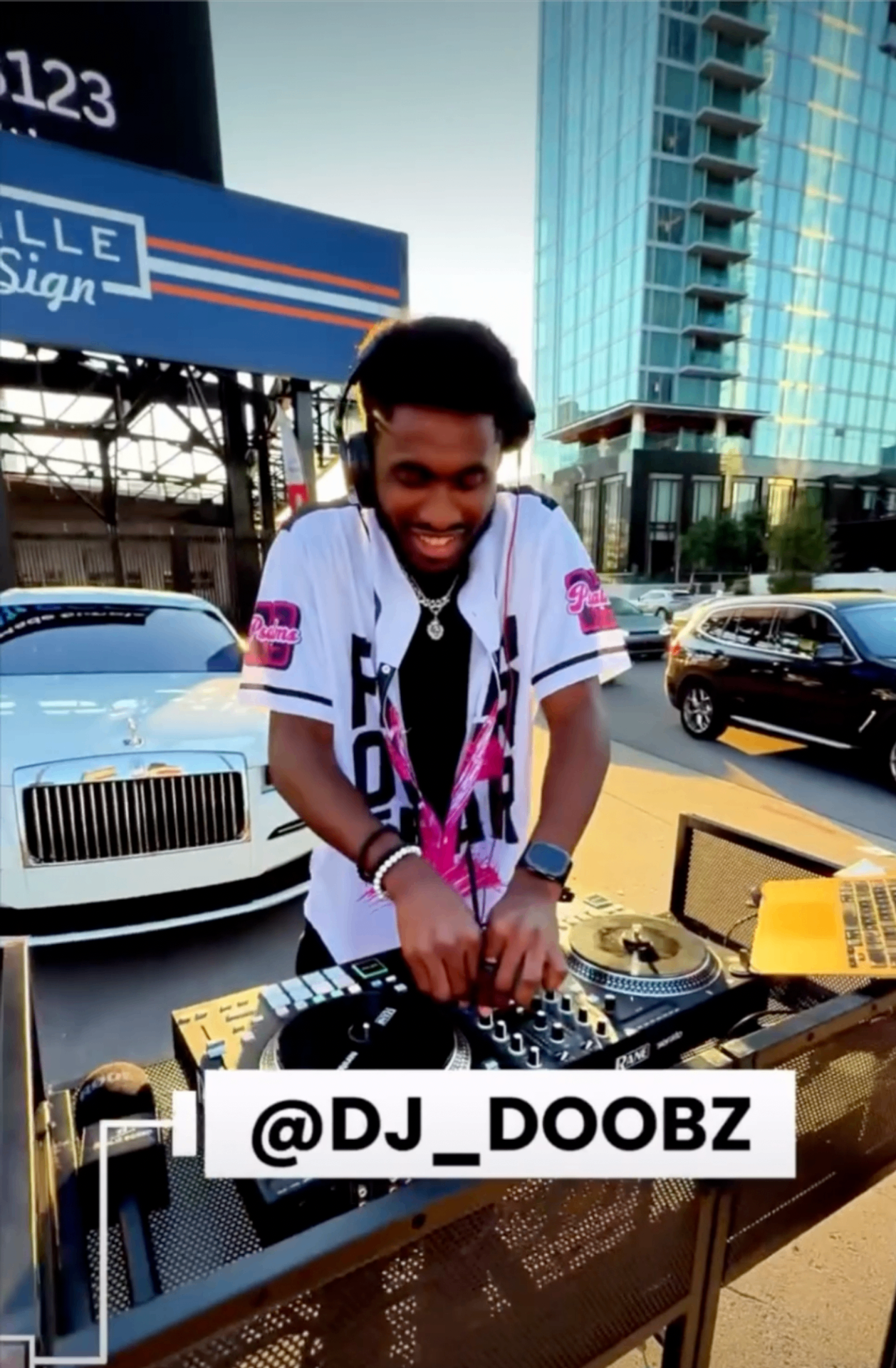 Handheld shot of DJ Doobz performing at the activation